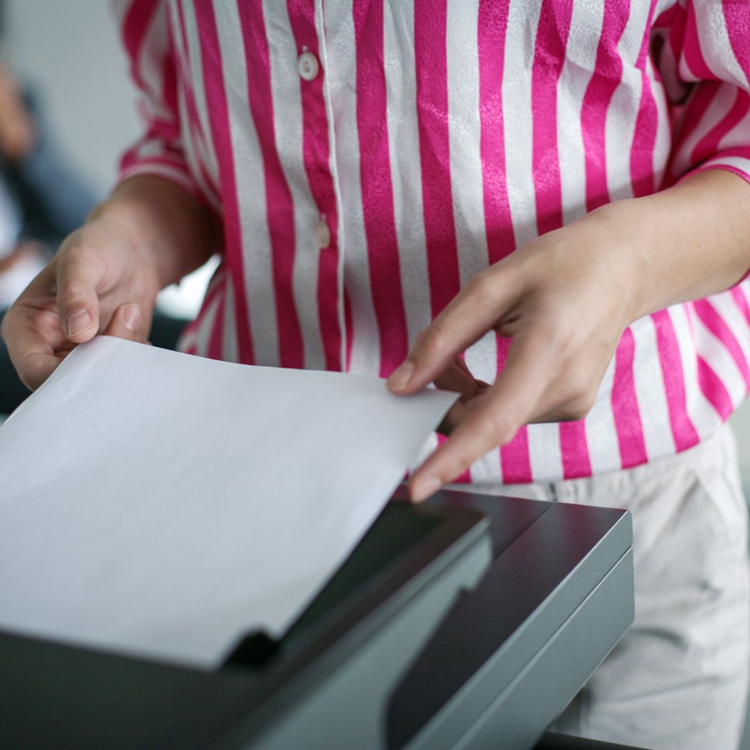 feeding paper into printer
